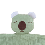 Green plush toy with a wombat face on a white background